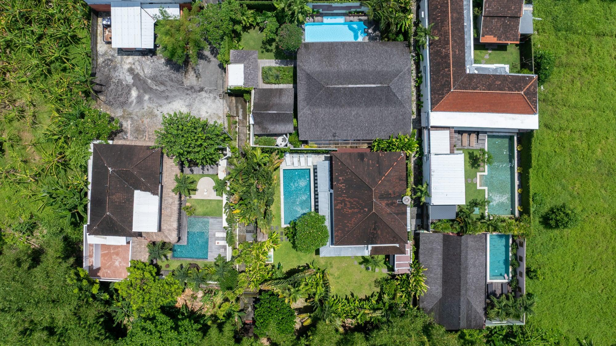 Aerial photograph of Bambu Complex, its five villas, and parking area